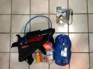 2L water, water treatment, chain lube, rag, batteries, backup charger, emergency bivi, charger cables, guidebook... 7.14 pounds total.  Better to carry this weight on the bike frame than on your back!!!